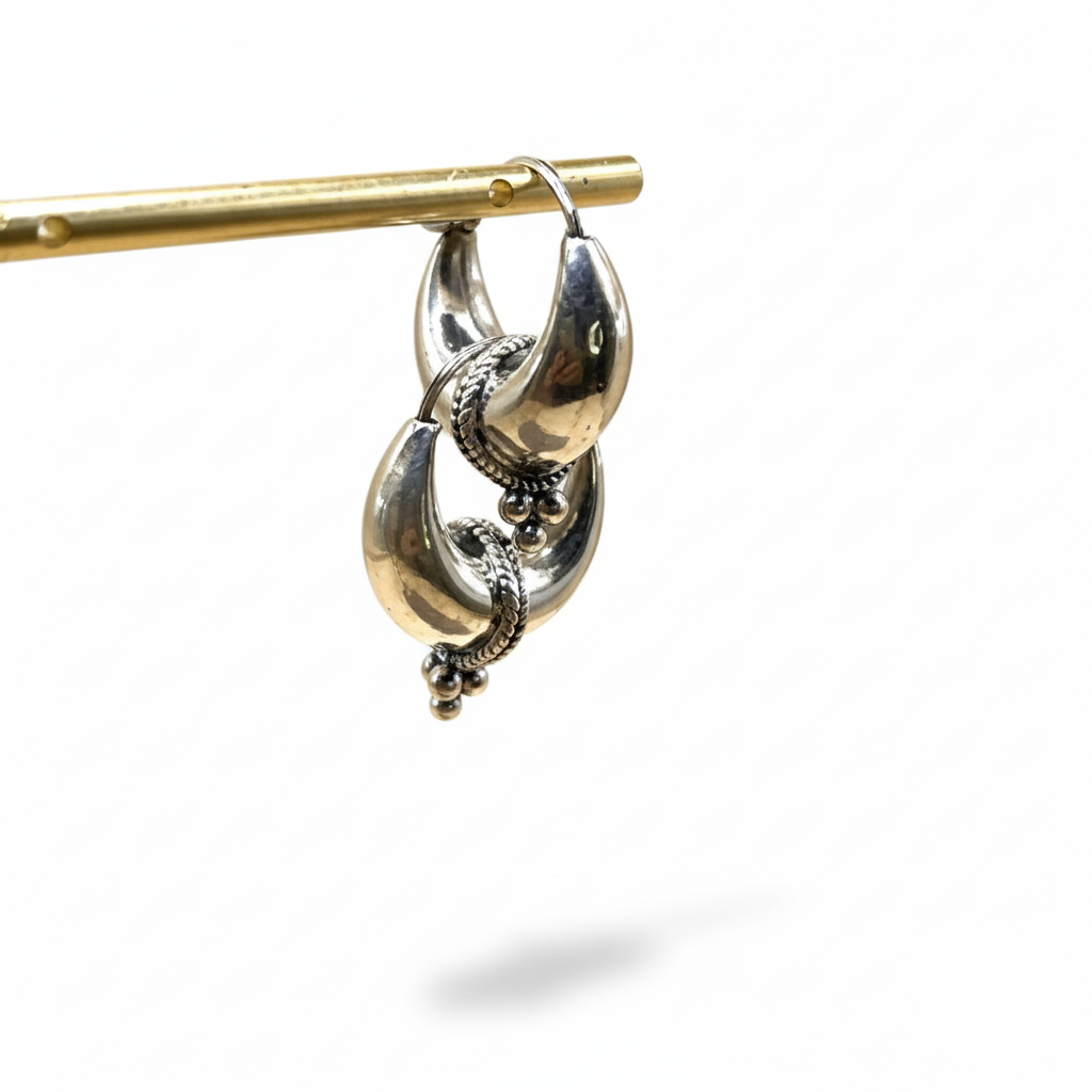 Silver hoop earrings on a white background