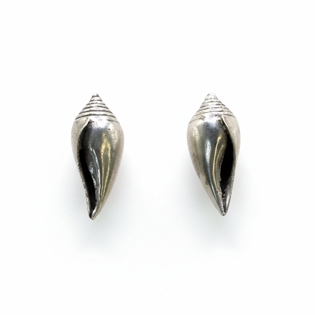 Pair of silver cone-shaped earrings on a white background