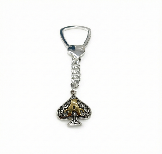 Silver keychain with a spade design on a white background