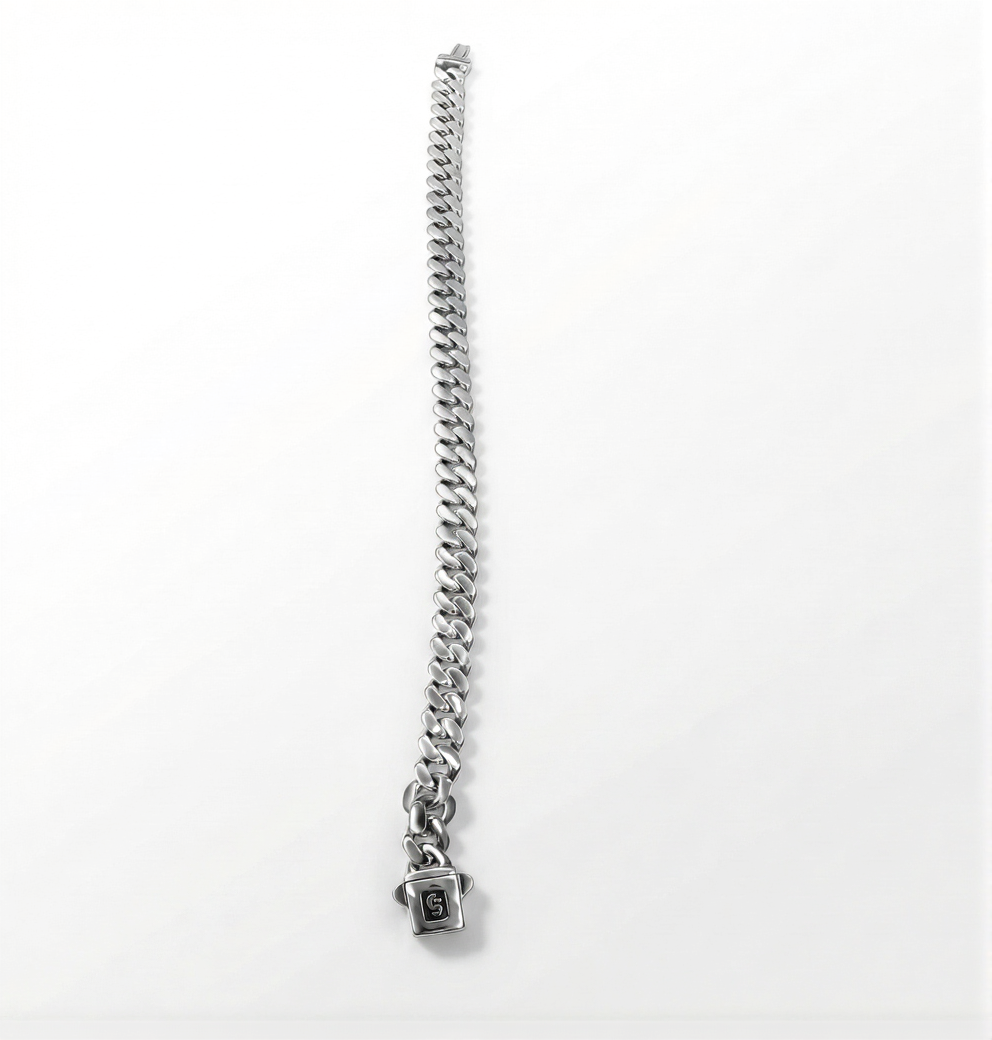 Silver chain bracelet with a small square charm on a white background