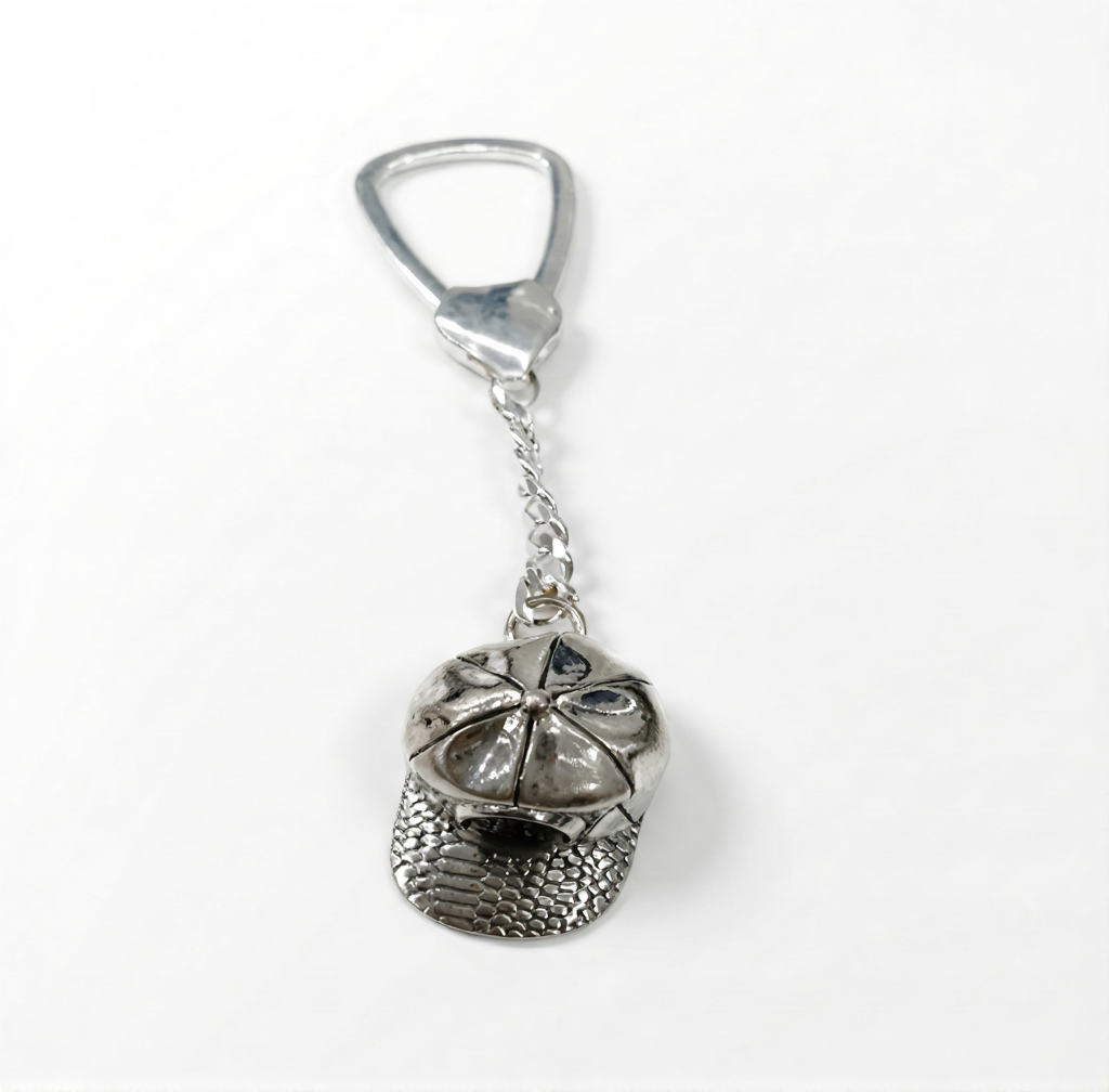 Silver keychain with a unique design on a white background