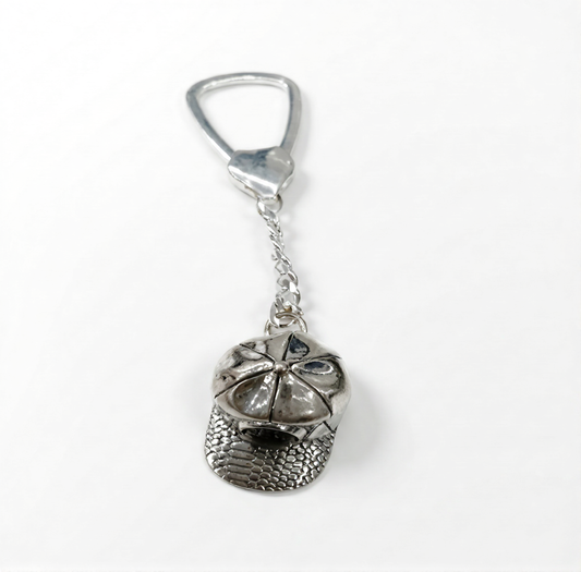 Silver keychain with a unique design on a white background